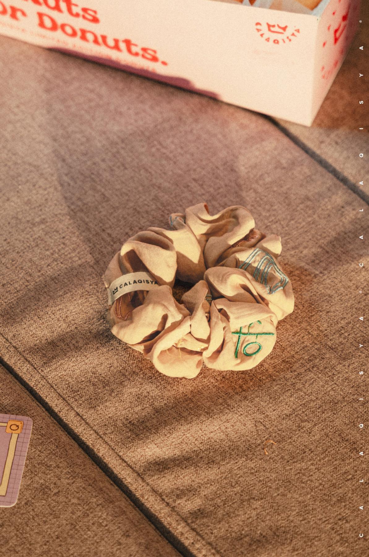 games-night-tie-tie-scrunchie-in-almond-buff-20240724152915